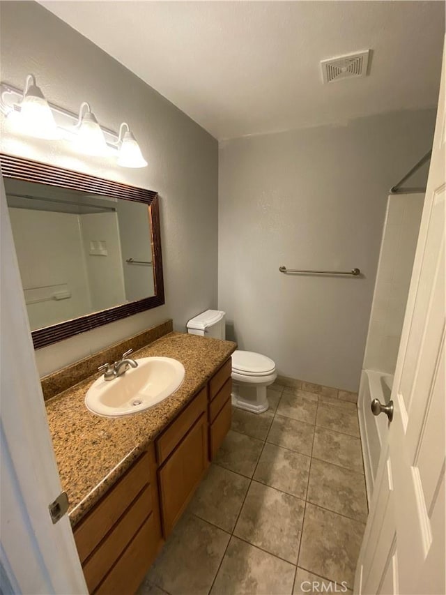 1114 Nord Ave Unit 11, Chico, CA 95926 - full bath with vanity, toilet, tile patterned floors, and washtub / shower combination