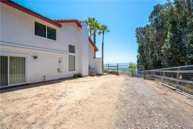 425 Calle Cielo, Nipomo, CA 93444 - view of property exterior with stucco siding, a water view, a tiled roof, and fence