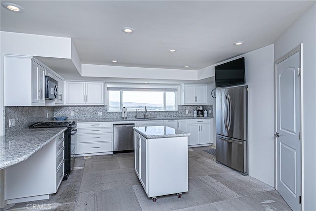 425 Calle Cielo, Nipomo, CA 93444 - kitchen featuring black appliances, a sink, backsplash, a center island, and white cabinetry