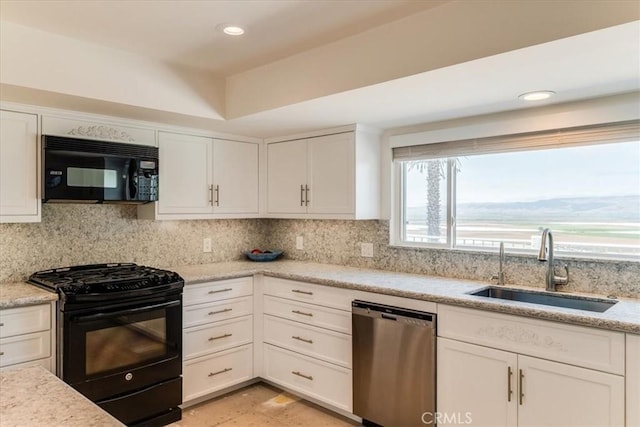 425 Calle Cielo, Nipomo, CA 93444 - kitchen with black appliances, white cabinets, backsplash, recessed lighting, and light stone counters
