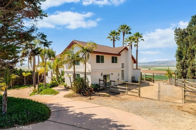 425 Calle Cielo, Nipomo, CA 93444 - view of front of house with stucco siding, a tiled roof, and a gate