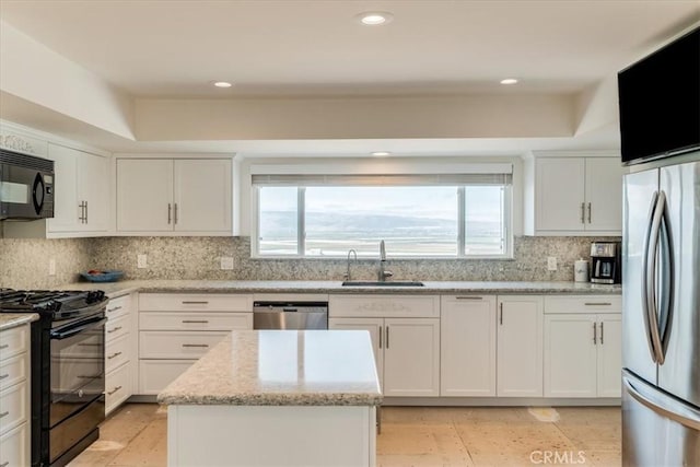 425 Calle Cielo, Nipomo, CA 93444 - kitchen with black appliances, healthy amount of natural light, backsplash, white cabinets, and recessed lighting
