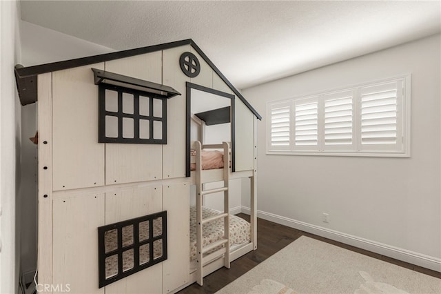 24772 Eldamar Ave, Lake Forest, CA 92630 - unfurnished bedroom with dark wood finished floors, baseboards, and vaulted ceiling