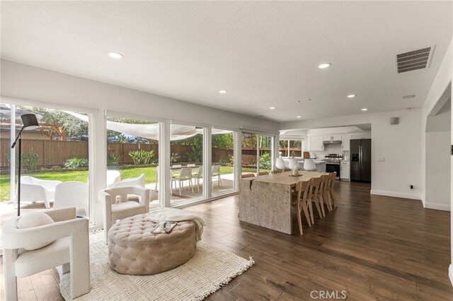 24772 Eldamar Ave, Lake Forest, CA 92630 - living area featuring plenty of natural light, dark wood-type flooring, recessed lighting, and baseboards
