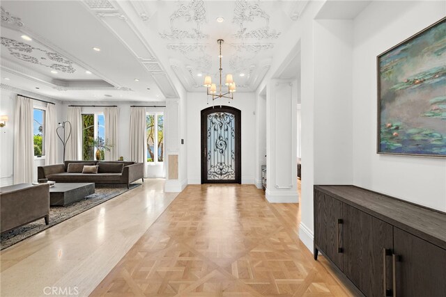 530 Kings Rd, Newport Beach, CA 92663 - entrance foyer with baseboards, a raised ceiling, a chandelier, and recessed lighting