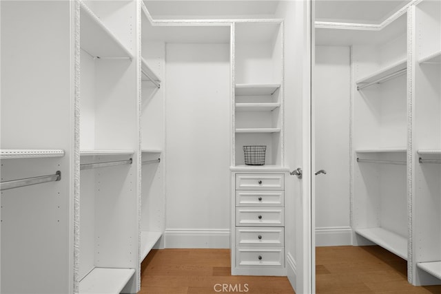 530 Kings Rd, Newport Beach, CA 92663 - spacious closet featuring light wood finished floors