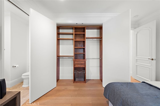 530 Kings Rd, Newport Beach, CA 92663 - bedroom featuring light wood finished floors, ornamental molding, and ensuite bathroom