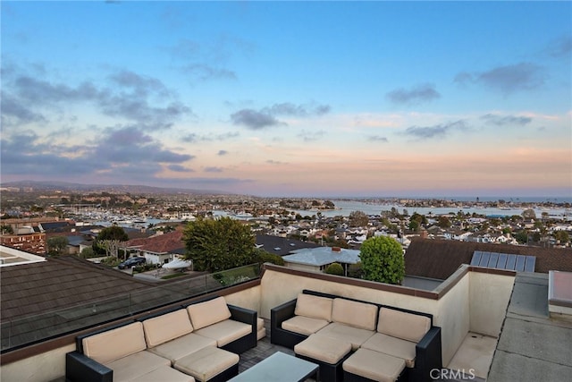 530 Kings Rd, Newport Beach, CA 92663 - patio terrace at dusk featuring an outdoor hangout area and a balcony