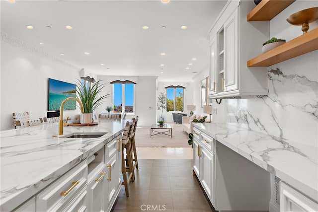 530 Kings Rd, Newport Beach, CA 92663 - kitchen featuring a sink, white cabinetry, recessed lighting, open floor plan, and backsplash