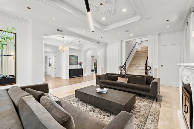 530 Kings Rd, Newport Beach, CA 92663 - living room featuring crown molding, arched walkways, recessed lighting, a raised ceiling, and stairway