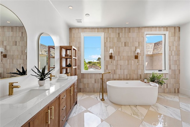 530 Kings Rd, Newport Beach, CA 92663 - full bath featuring tile walls, a freestanding bath, and double vanity
