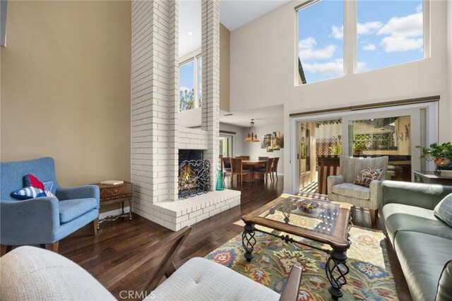 1412 Alta Mesa Way, Brea, CA 92821 - living room with hardwood / wood-style floors, a high ceiling, and a fireplace