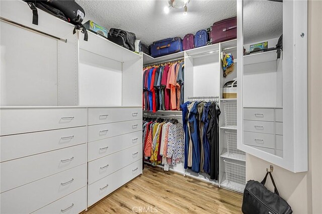 1412 Alta Mesa Way, Brea, CA 92821 - walk in closet with wood finished floors
