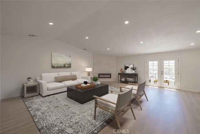 16739 Mission St, Hesperia, CA 92345 - living area featuring wood finished floors, recessed lighting, french doors, baseboards, and a fireplace