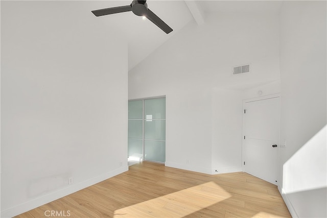 27 Burriana, San Clemente, CA 92672 - empty room with a ceiling fan, beamed ceiling, high vaulted ceiling, wood finished floors, and baseboards