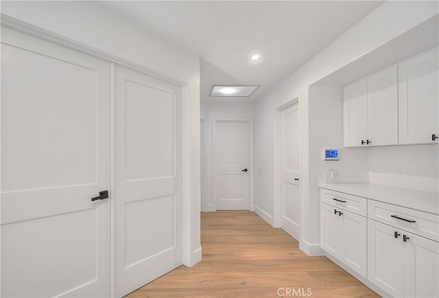 27 Burriana, San Clemente, CA 92672 - corridor featuring light wood-style flooring, recessed lighting, and baseboards
