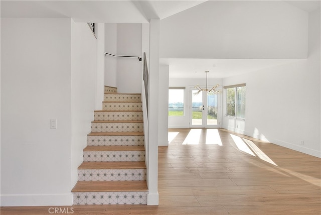 27 Burriana, San Clemente, CA 92672 - stairs with wood finished floors, baseboards, and a chandelier