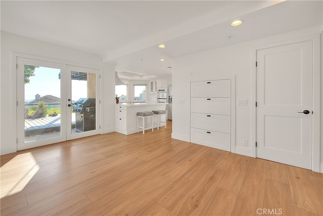 27 Burriana, San Clemente, CA 92672 - unfurnished living room with light wood finished floors, recessed lighting, and french doors