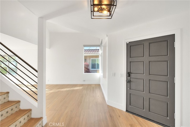 27 Burriana, San Clemente, CA 92672 - foyer with light wood-style flooring, stairway, and baseboards