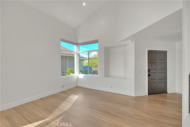 27 Burriana, San Clemente, CA 92672 - empty room with baseboards, light wood-type flooring, high vaulted ceiling, and recessed lighting