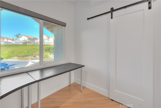 27 Burriana, San Clemente, CA 92672 - unfurnished office featuring a barn door and light wood finished floors