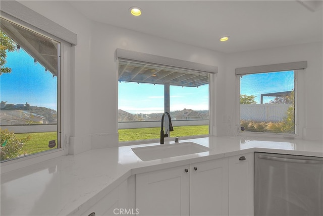 27 Burriana, San Clemente, CA 92672 - kitchen featuring stainless steel dishwasher, a sink, white cabinets, and recessed lighting