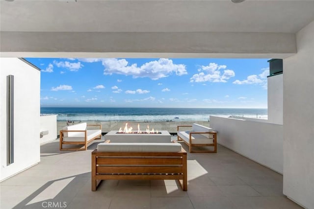 5007 Seashore Dr, Newport Beach, CA 92663 - view of patio featuring view of water and beach and an outdoor living space with a fire pit