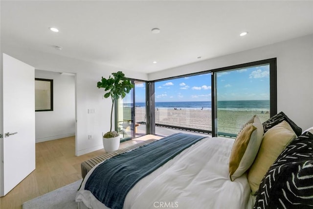 5007 Seashore Dr, Newport Beach, CA 92663 - bedroom featuring access to outside, wood finished floors, baseboards, a water view, and recessed lighting
