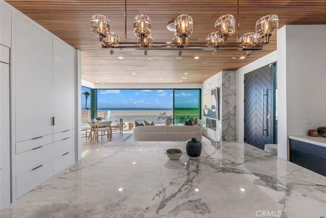 5007 Seashore Dr, Newport Beach, CA 92663 - living area featuring a chandelier, wood ceiling, a wall of windows, and recessed lighting
