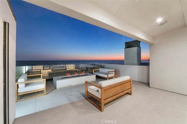 5007 Seashore Dr, Newport Beach, CA 92663 - view of patio / terrace with an outdoor living space with a fire pit