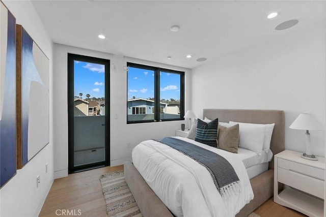 5007 Seashore Dr, Newport Beach, CA 92663 - bedroom with light wood finished floors, recessed lighting, baseboards, and access to exterior