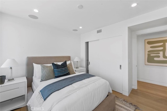 5007 Seashore Dr, Newport Beach, CA 92663 - bedroom with wood finished floors, recessed lighting, a closet, and baseboards