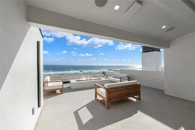 5007 Seashore Dr, Newport Beach, CA 92663 - balcony featuring an outdoor fire pit and view of water and beach