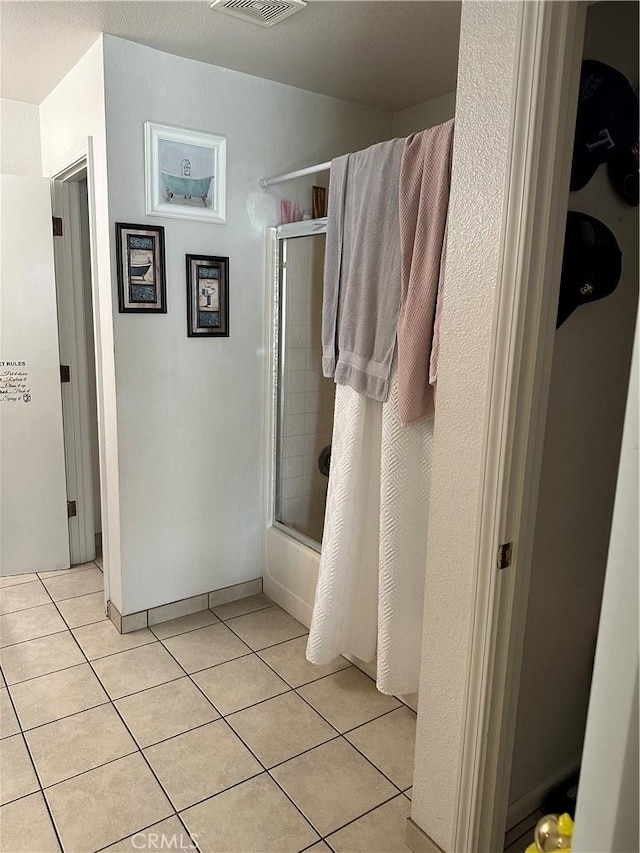 336 Pyramid Ave, Merced, CA 95341 - bathroom featuring tile patterned floors and enclosed tub / shower combo