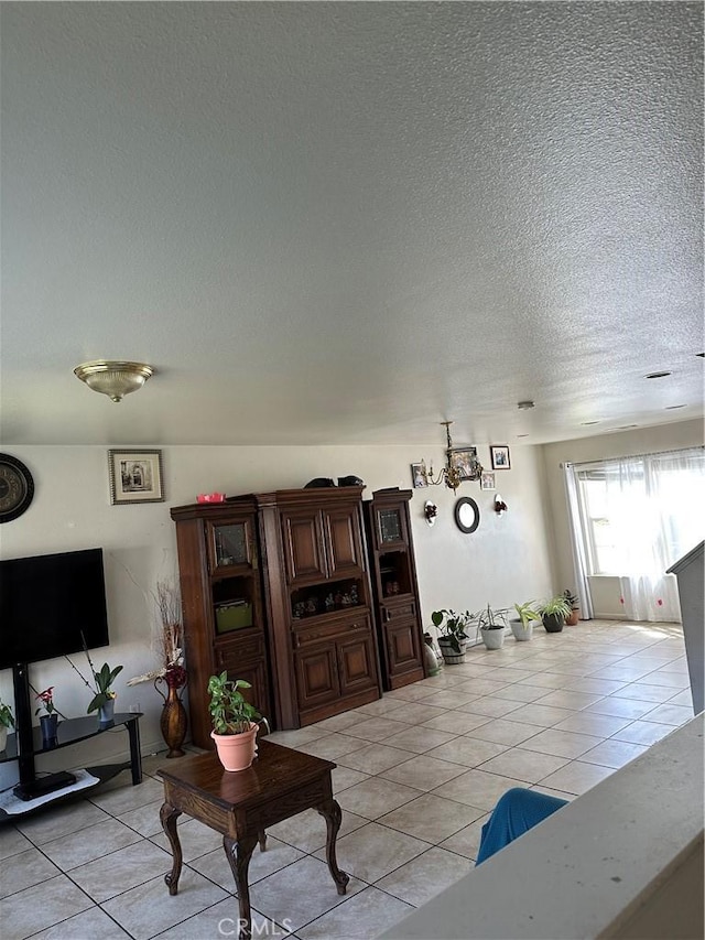 336 Pyramid Ave, Merced, CA 95341 - living room with a textured ceiling and light tile patterned flooring