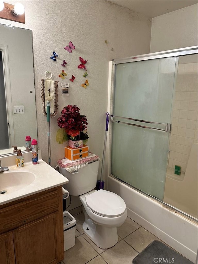 336 Pyramid Ave, Merced, CA 95341 - full bathroom with tile patterned floors, shower / bath combination with glass door, vanity, and toilet