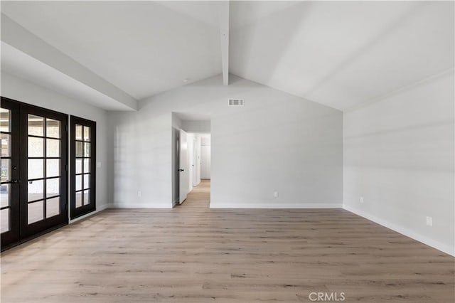 unfurnished room featuring french doors, wood finished floors, and baseboards