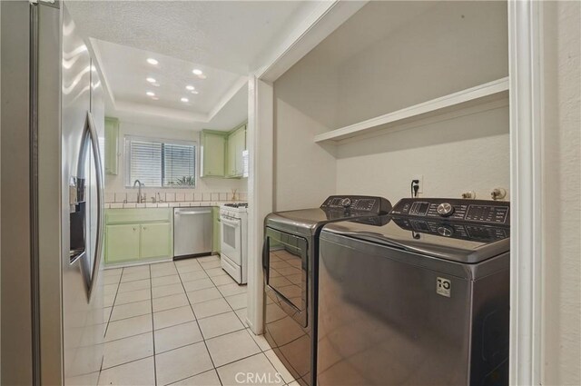 2101 E 21st St Unit 310, Signal Hill, CA 90755 - laundry area featuring light tile patterned floors, separate washer and dryer, and recessed lighting