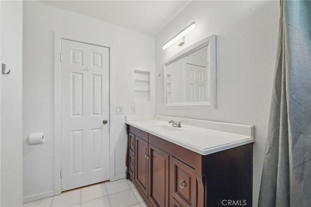2101 E 21st St Unit 310, Signal Hill, CA 90755 - bathroom with vanity, tile patterned floors, and baseboards