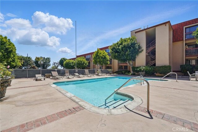2101 E 21st St Unit 310, Signal Hill, CA 90755 - community pool featuring a patio area and fence