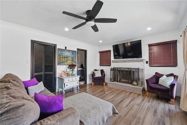 9489 Muroc St, Bellflower, CA 90706 - living room featuring ceiling fan, a fireplace, wood finished floors, crown molding, and recessed lighting