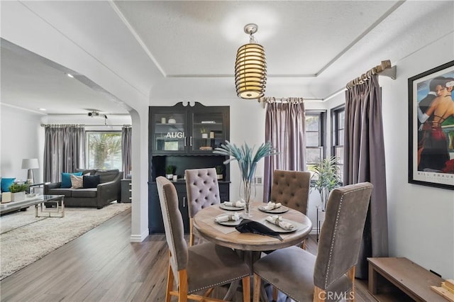9489 Muroc St, Bellflower, CA 90706 - dining space featuring wood finished floors and arched walkways