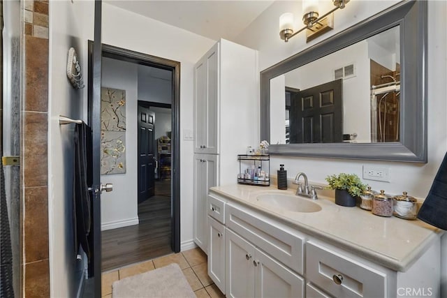 9489 Muroc St, Bellflower, CA 90706 - full bathroom featuring tile patterned floors, vanity, and a shower