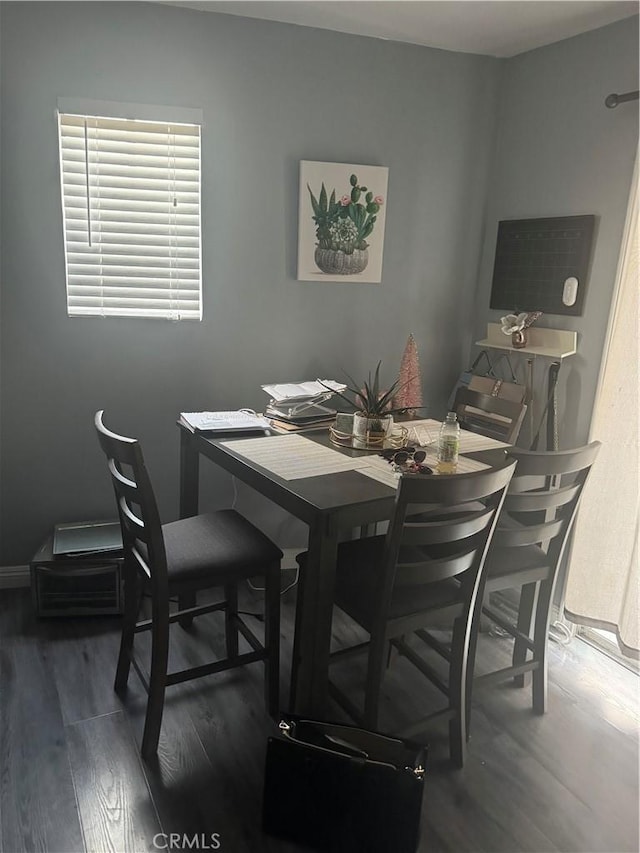 9489 Muroc St, Bellflower, CA 90706 - dining area featuring wood finished floors and baseboards
