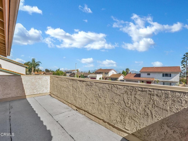 view of patio / terrace with a residential view and a balcony