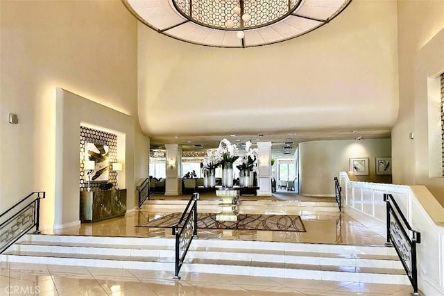6 Whittier Ct, Rancho Mirage, CA 92270 - tiled foyer entrance with a towering ceiling, baseboards, and inlaid floor details