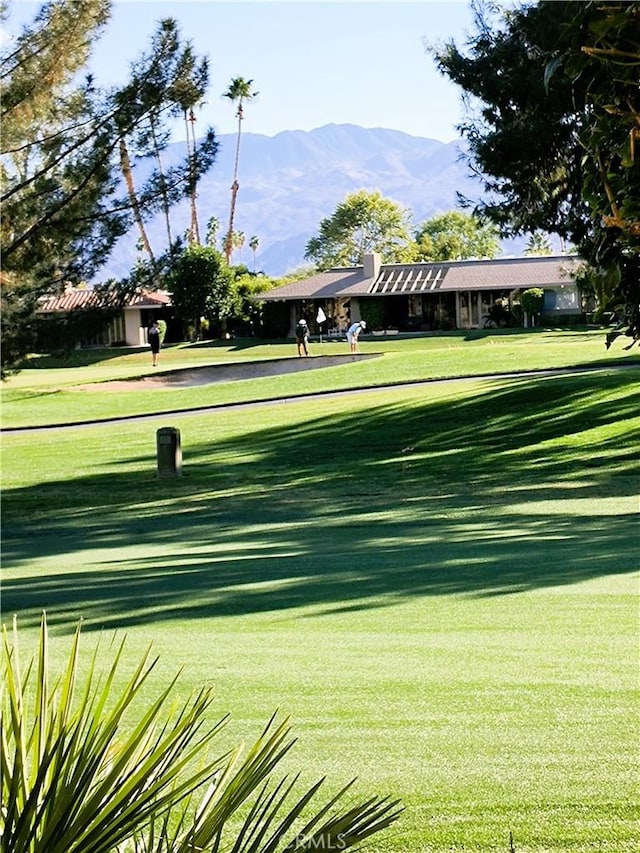 6 Whittier Ct, Rancho Mirage, CA 92270 - surrounding community with a mountain view and a lawn