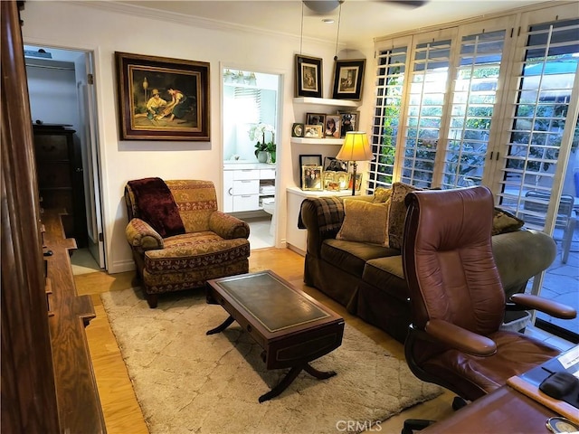 6 Whittier Ct, Rancho Mirage, CA 92270 - living area with crown molding and light wood-style floors