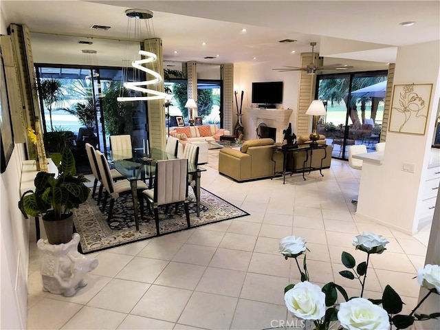 6 Whittier Ct, Rancho Mirage, CA 92270 - dining room with light tile patterned floors, ceiling fan, recessed lighting, and a fireplace