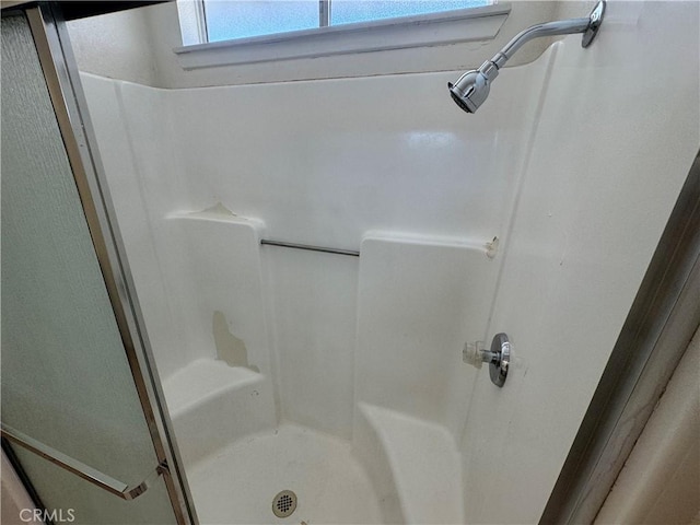 bathroom featuring a stall shower